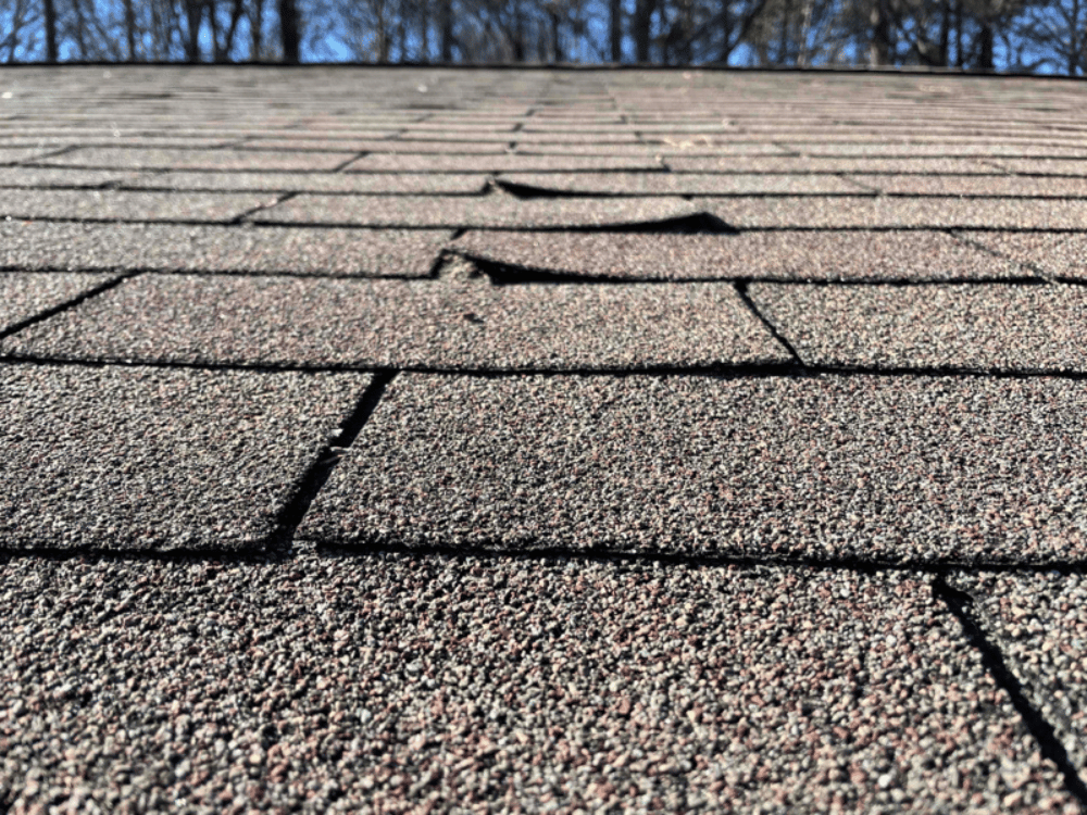 What causes nail pops on a roof