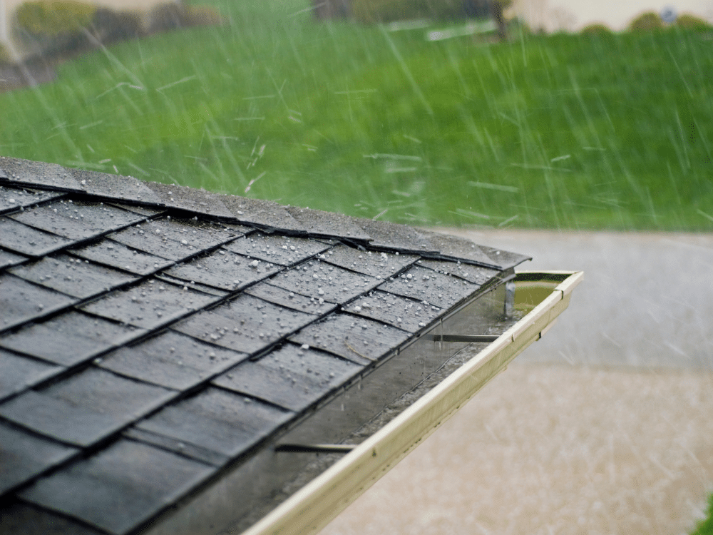 Hail falling on asphalt shingle roof