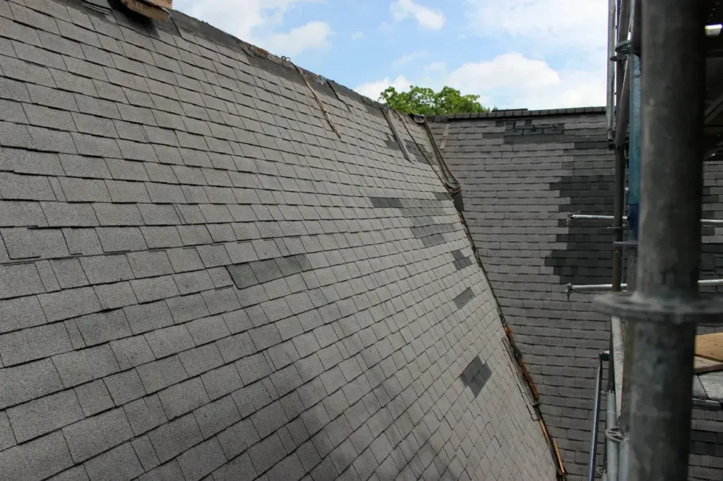 Church-roof-patch-repairs-missing-shingles - Artisan Quality Roofing Church-roof-patch-repairs-missing-shingles