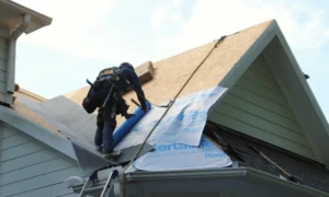 Roofer installing a new roof after answering how much is a new roof